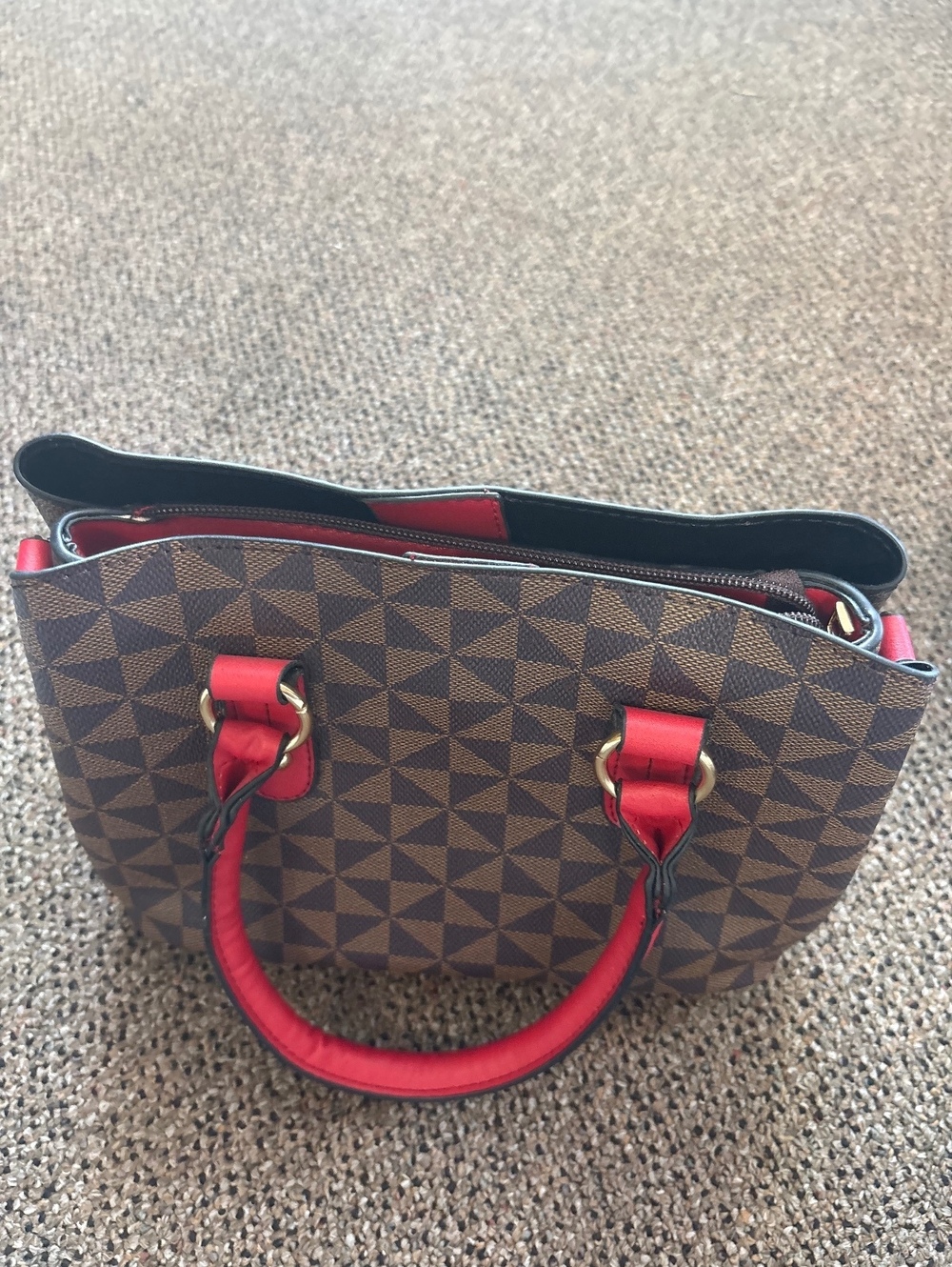 Brown geometric print handbag with red handles
